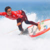 Jhony Corzo compitiendo en ISA World Surfing Games